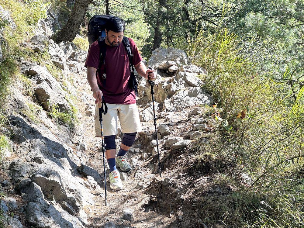 Hiking using knee braces on trail