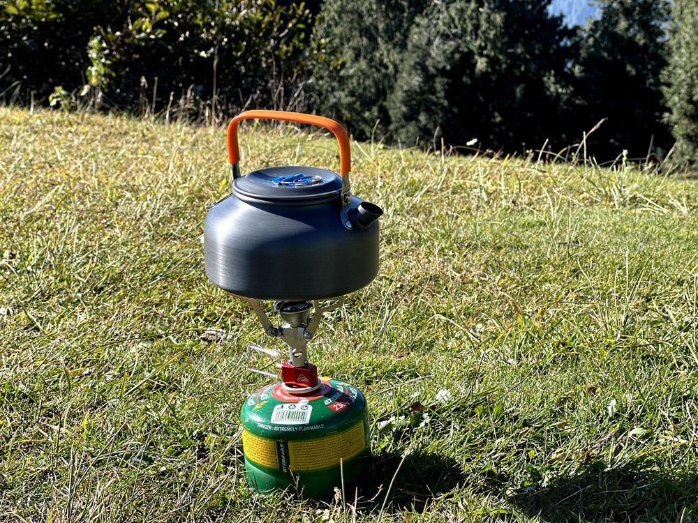 Boiling water in camping kettle while camping