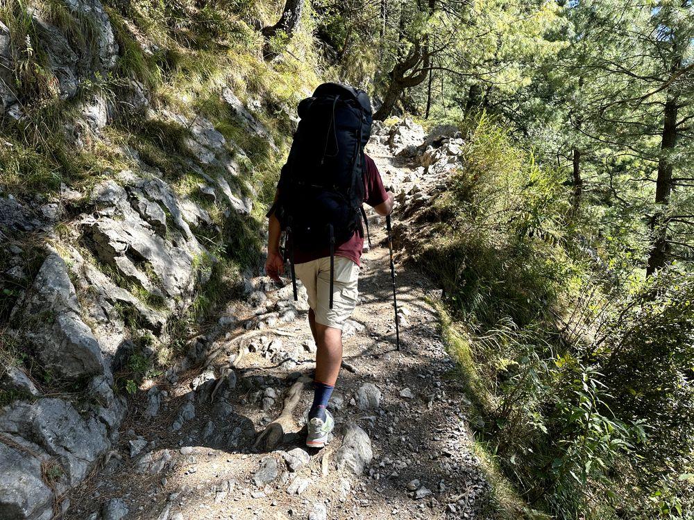 Trekking on a rough trail using trekking pole