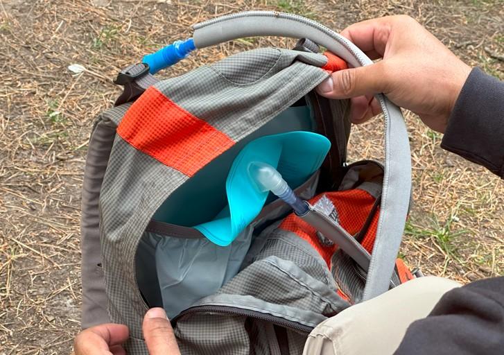 Daypack - This shot shows an integrated hydration bladder system inside, with the drinking tube secured at the top.