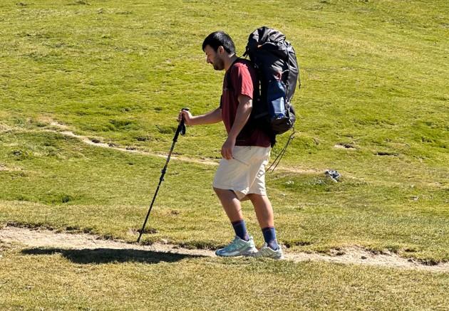 Hiking in shorts along with Wool socks and backpack (During summer hikes, I wear hiking shorts that help me stay comfortable on the trail)