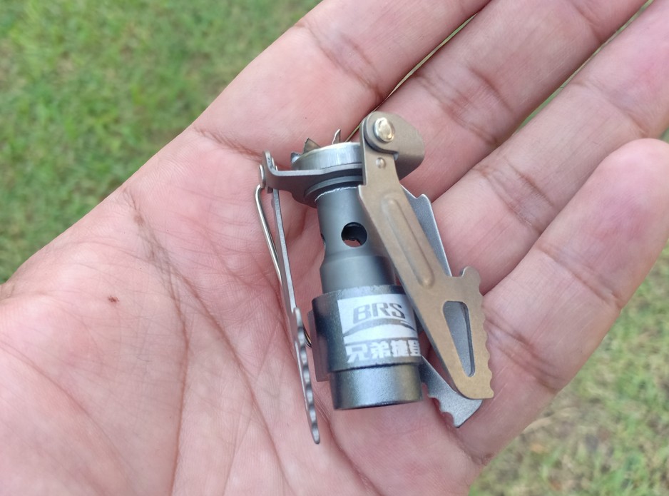 Folded BRS-3000T ultralight titanium stove held in one hand