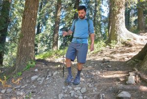 Hiking socks for sweaty feet: wearing crew height hiking socks on a rocky forest trail in warm conditions showing real world performance for sweaty feet