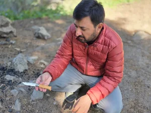 Holding the Opinel No. 08 INOX knife during a backpacking trip
